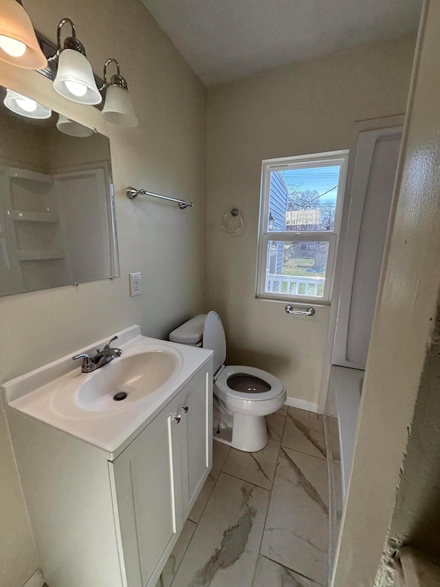 bathroom with vanity and toilet