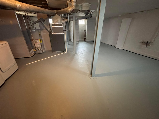 basement with washer / clothes dryer, gas water heater, and heating unit