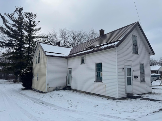 view of snow covered house