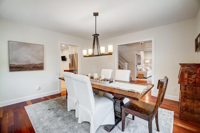 dining space with dark wood-type flooring