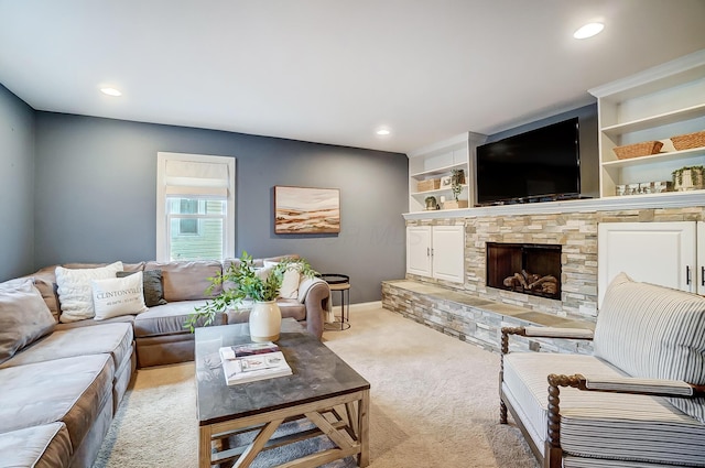 living room with light colored carpet and a fireplace