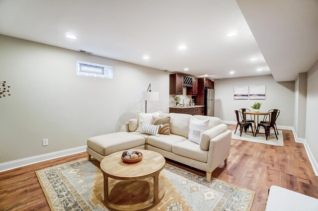 living room with light hardwood / wood-style floors