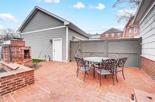 view of patio featuring a fireplace