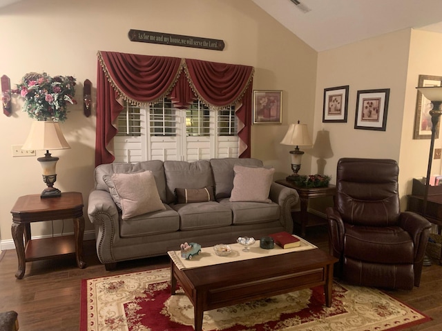 living room featuring dark hardwood / wood-style floors and lofted ceiling