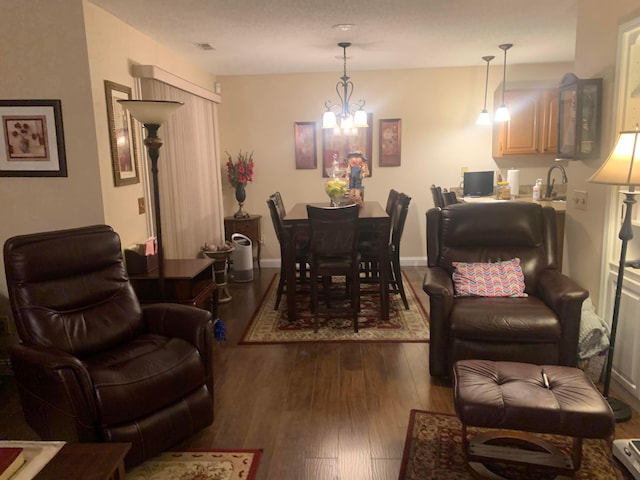 interior space with a chandelier, dark hardwood / wood-style flooring, and sink