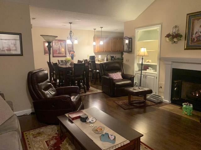 living room featuring dark wood-type flooring and sink