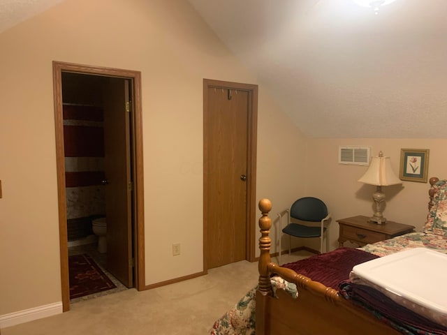 carpeted bedroom with lofted ceiling