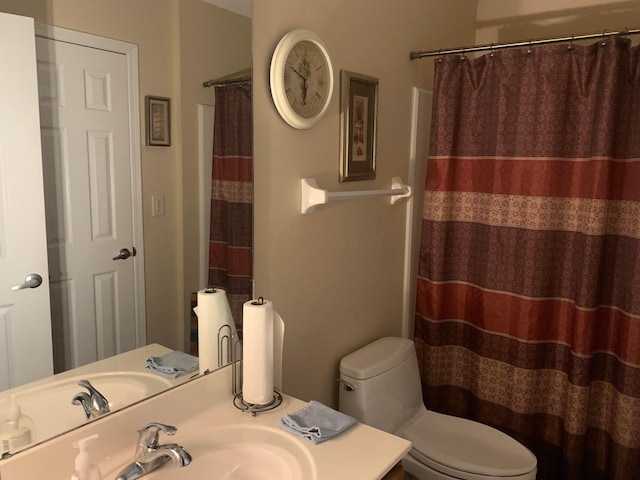 bathroom featuring sink and toilet