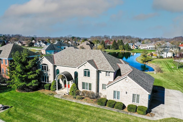 view of front of property with a water view and a front yard