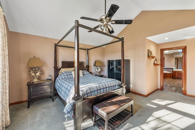 bedroom with ceiling fan, ensuite bathroom, lofted ceiling, and light carpet