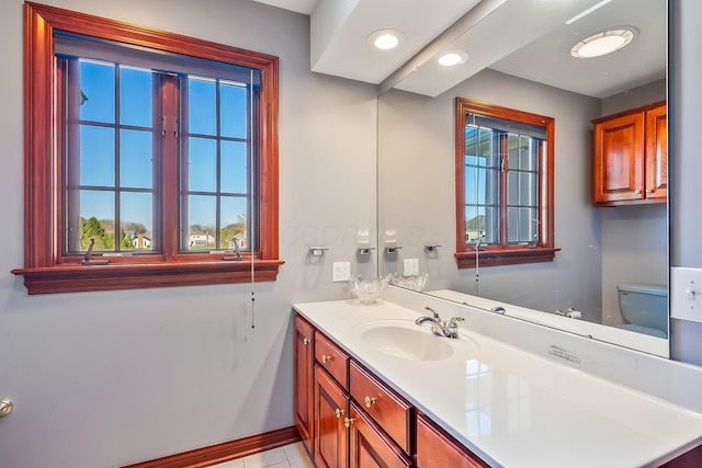 bathroom with tile patterned floors, vanity, and toilet