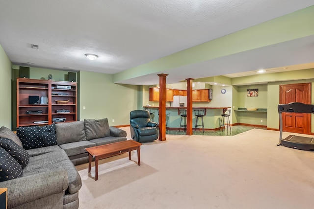 living room featuring carpet and a textured ceiling