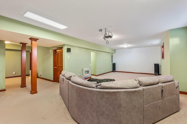 cinema room featuring light colored carpet and heating unit