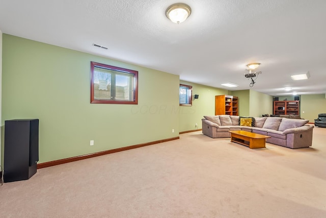 living room with carpet flooring and a textured ceiling