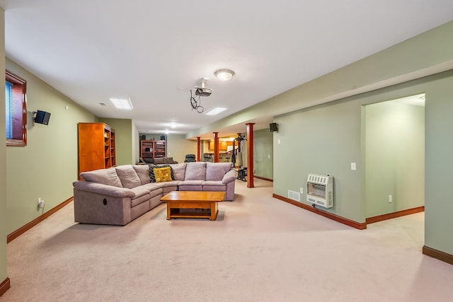 living room featuring light carpet and heating unit