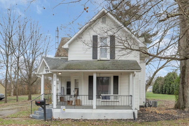 view of front facade featuring cooling unit and covered porch