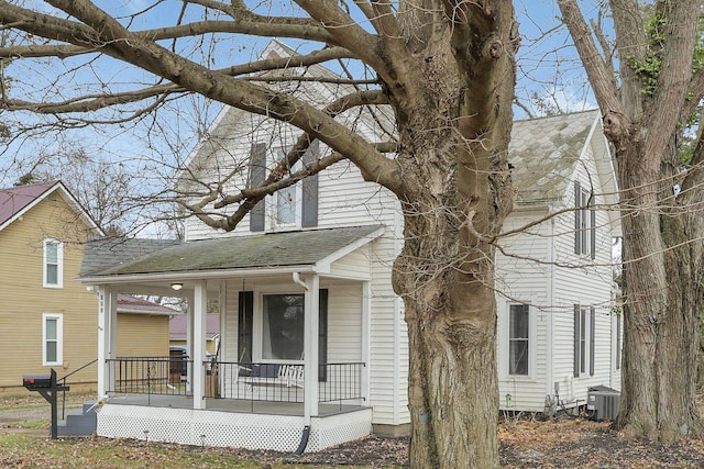 view of front of house featuring central AC unit and a porch