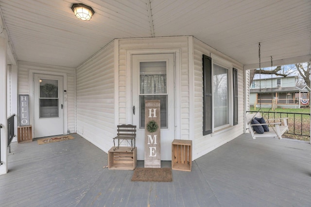 entrance to property featuring a porch