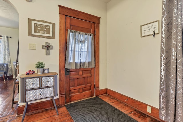 foyer entrance featuring wood-type flooring and a wealth of natural light