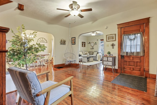 foyer entrance featuring a textured ceiling, hardwood / wood-style flooring, ceiling fan, and lofted ceiling