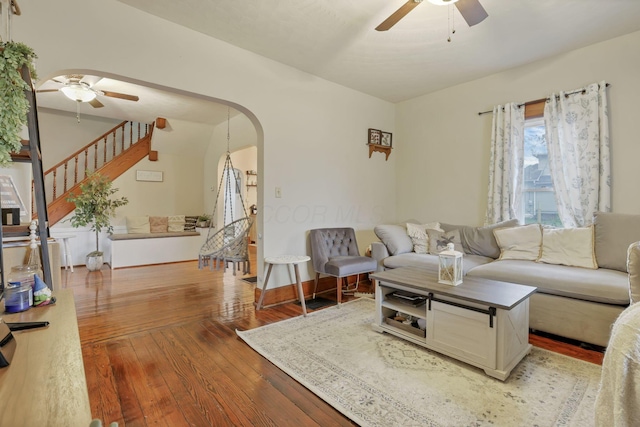 living room with ceiling fan and wood-type flooring