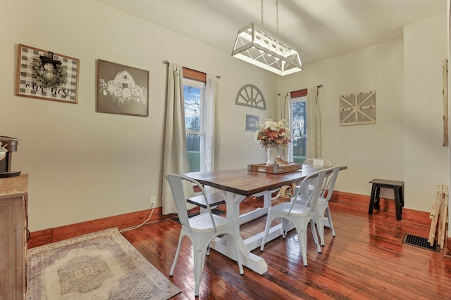 dining area featuring hardwood / wood-style floors