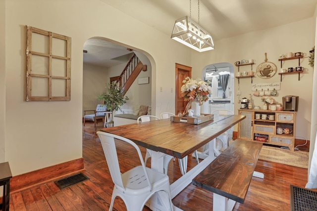 dining space featuring a chandelier and dark hardwood / wood-style floors