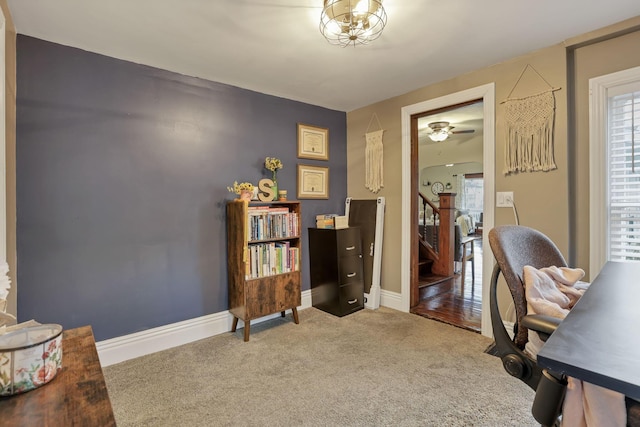 carpeted office featuring ceiling fan