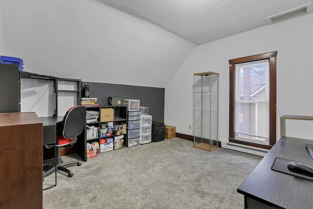 carpeted office space featuring a textured ceiling, lofted ceiling, and a baseboard heating unit