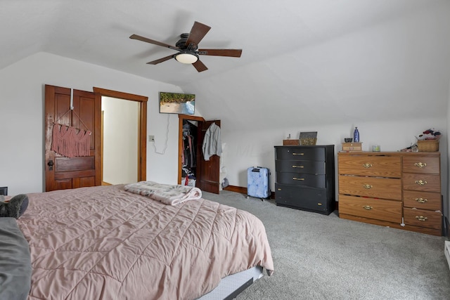 carpeted bedroom featuring ceiling fan and lofted ceiling