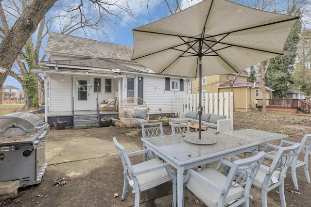 view of patio with a grill and an outdoor hangout area