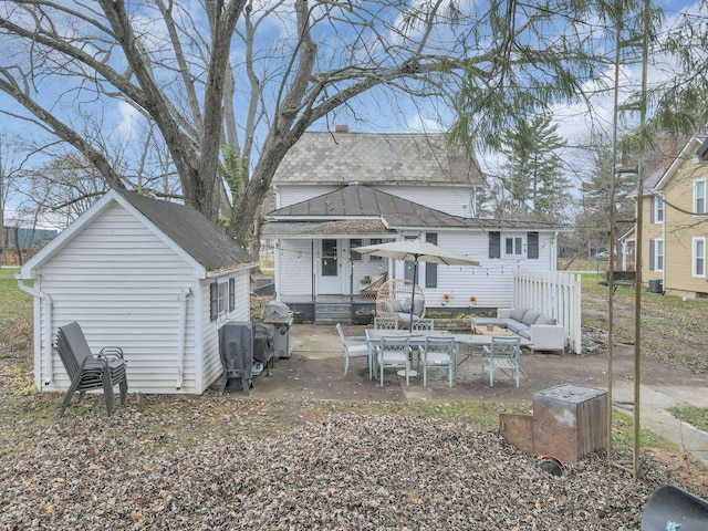 rear view of house featuring a patio