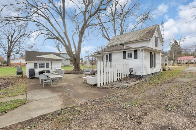 view of side of home featuring a patio area