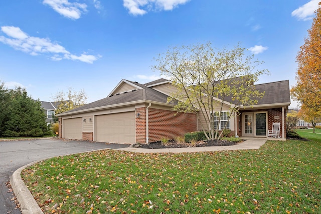 single story home with a front yard and a garage