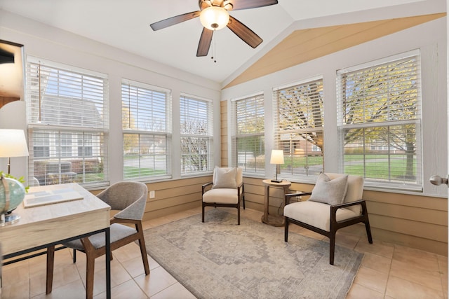 sunroom with ceiling fan and vaulted ceiling