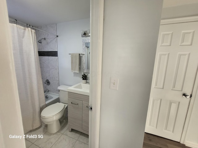 full bathroom featuring shower / tub combo, vanity, and toilet