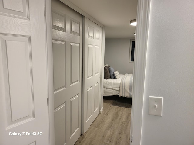 corridor featuring light hardwood / wood-style floors