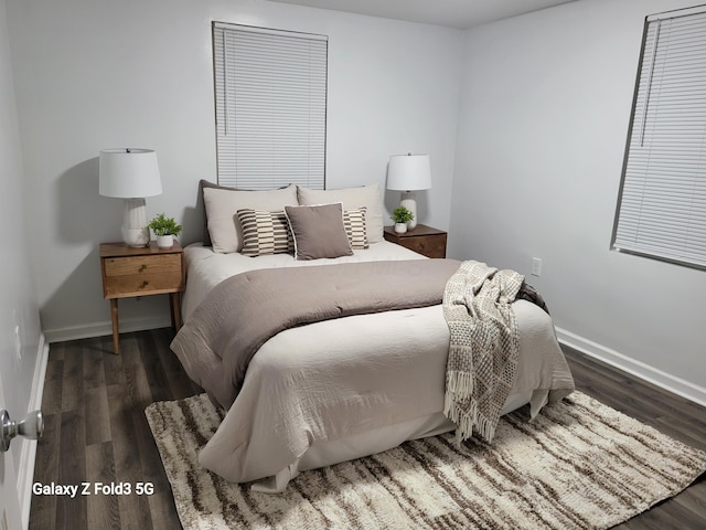 bedroom featuring dark hardwood / wood-style flooring