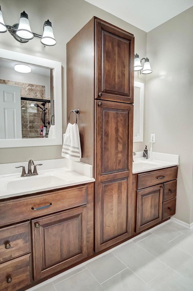 bathroom featuring vanity, tile patterned flooring, and a shower with shower door