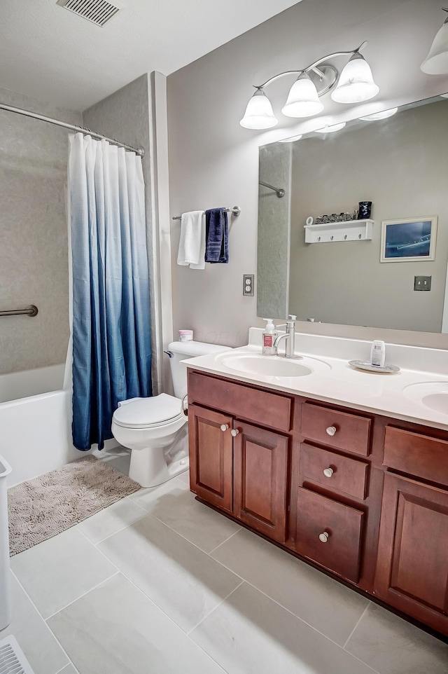 full bathroom featuring tile patterned flooring, vanity, toilet, and shower / bath combo with shower curtain