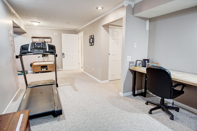 carpeted home office featuring ornamental molding