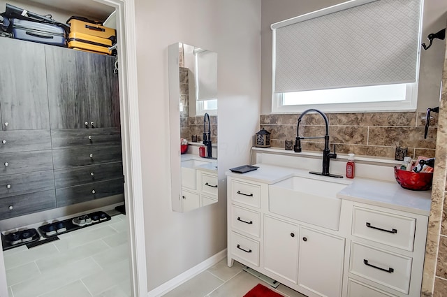 bathroom with tile patterned flooring and vanity