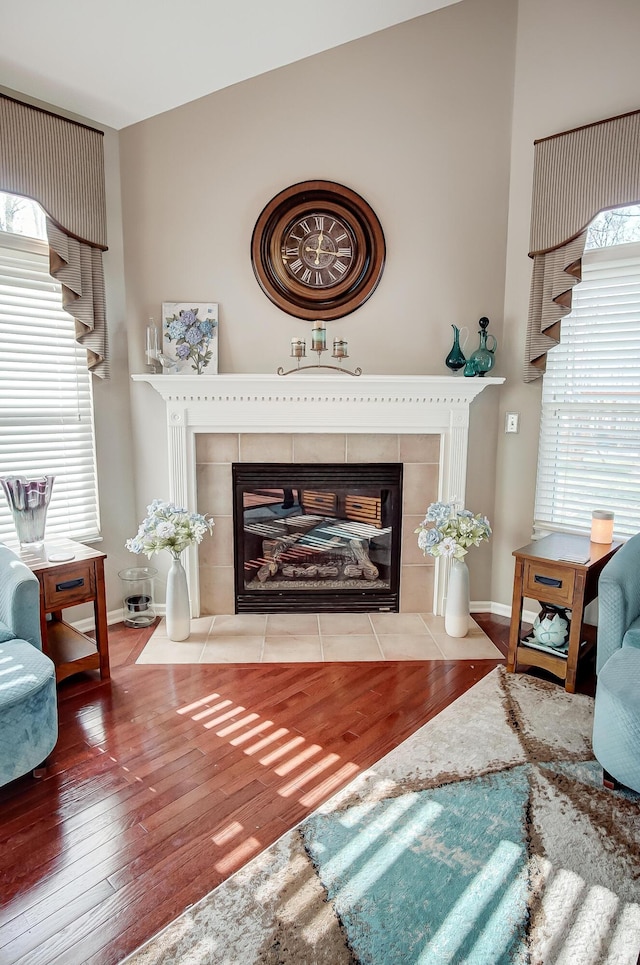 sitting room featuring hardwood / wood-style flooring and a fireplace