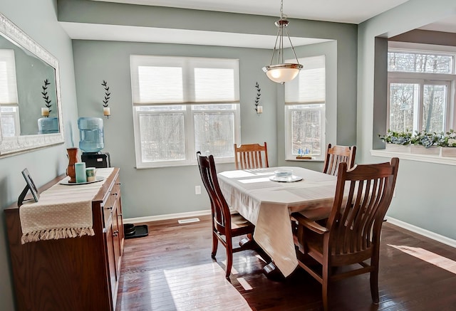 dining space featuring dark hardwood / wood-style flooring