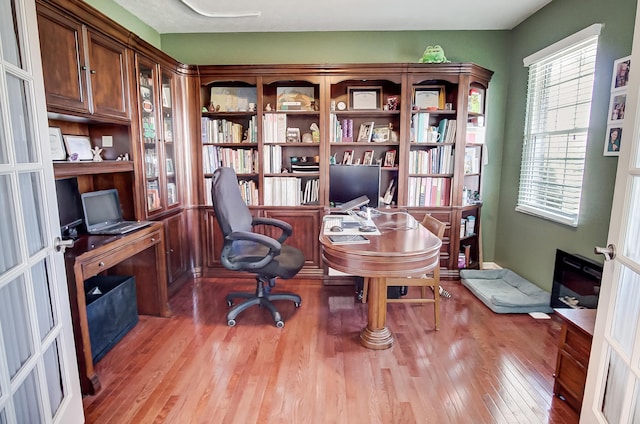 office space with french doors and light wood-type flooring