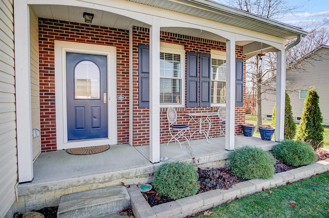 entrance to property featuring a porch