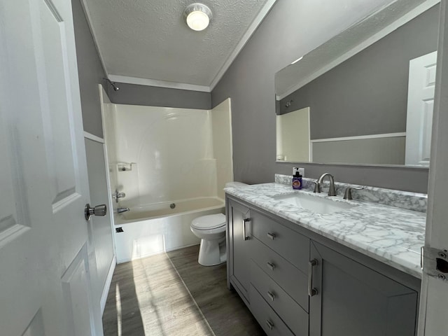 full bathroom with vanity, a textured ceiling, wood-type flooring, shower / tub combination, and toilet