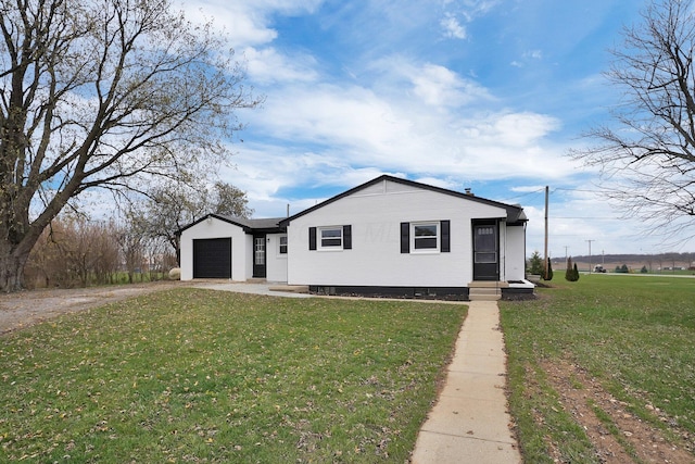 view of front of house featuring a garage and a front lawn