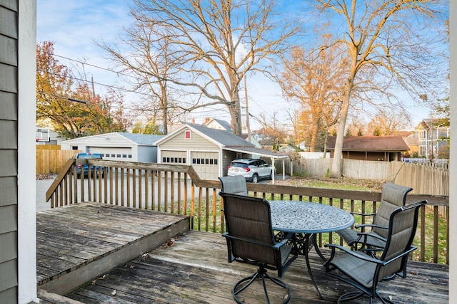 deck featuring a garage and an outdoor structure