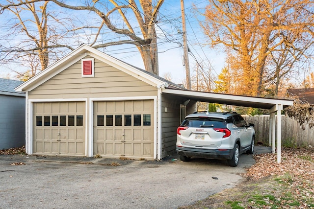 garage featuring a carport